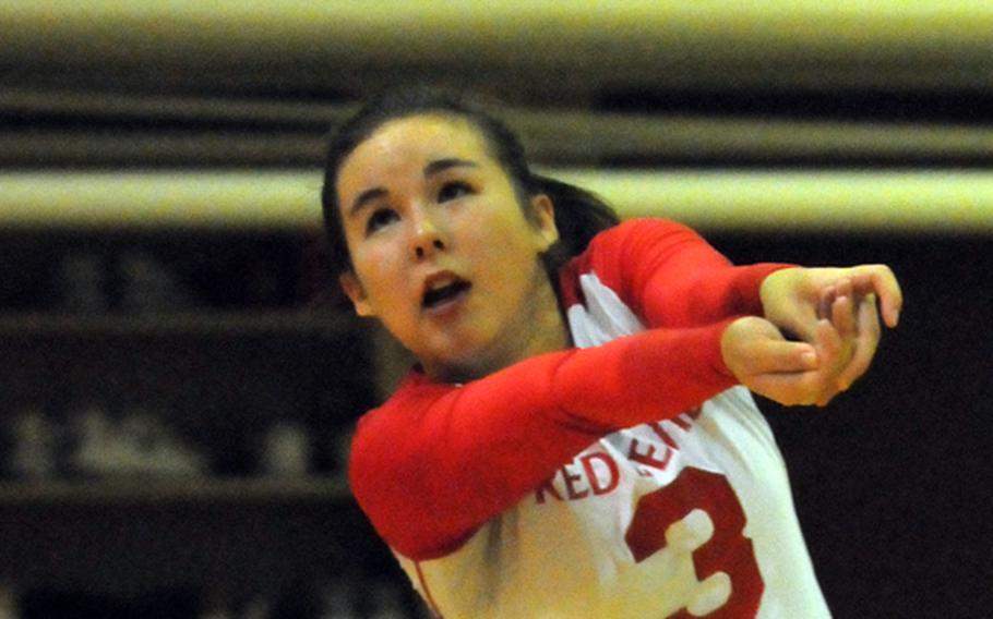 Nile C. Kinnick Red Devils libero Kaile Johnson bumps the ball against the Seisen International Phoenix  during Tuesday's Kanto Plain Association of Secondary Schools girls volleyball match at the Phoenix Center, Seisen International School, Tokyo.