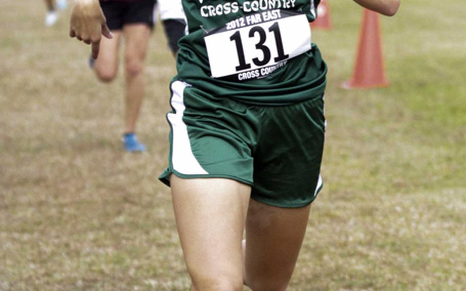 Kubasaki Dragons senior Allie Reichenberg crosses the finish line second in the 3.1-mile individual girls-race portion of the Far East High School Cross-Country meet at Camp Fuji, Japan on Nov. 5, 2012. Ana Hernandez of Kadena won the race and Kadena the girls Division I team title.