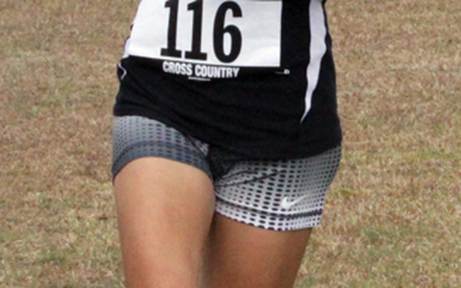 Kadena Panthers junior Ana Hernandez crosses the finish line first in the 3.1-mile individual girls-race portion of the Far East High School Cross-Country meet at Camp Fuji, Japan on Nov. 5, 2012. Kadena's girls also won the Division I team title.