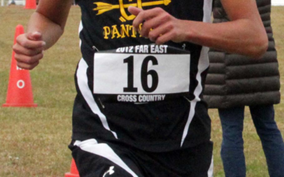 Kadena Panthers junior Andrew Kilkenny crosses the finish line first in the 3.1-mile individual boys-race portion of the Far East High School Cross-Country meet at Camp Fuji, Japan on Nov. 5, 2012.