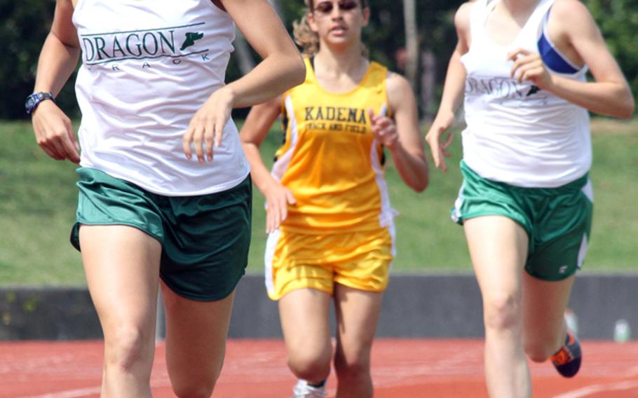 Kubasaki's Allie Reichenberg sets the pace down the stretch of the 800-meter run with teammate Jessica Ircink and Kadena's Ana Hernandez trailing during Saturday's Okinawa Activities Council weekly quadrangular at Chatan, Okinawa. Reichenberg won in 2 minutes, 27.91 seconds.