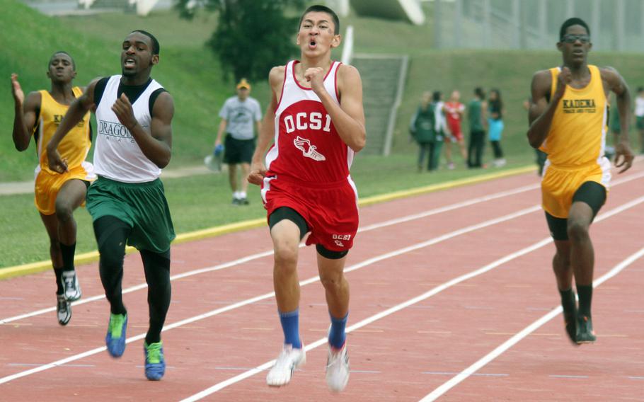 Okinawa Christian School International's Shawn Monroe leads the pack down the home stretch of the boys 400-meter dash with Kubasaki's DeQuan Alderman flanking him to his right and Kadena's Boysie Gorden to his left during Friday's Okinawa Activities Council track and field quadrangular meet at Kadena Air Base, Okinawa. Monroe won in 53.59 seconds.