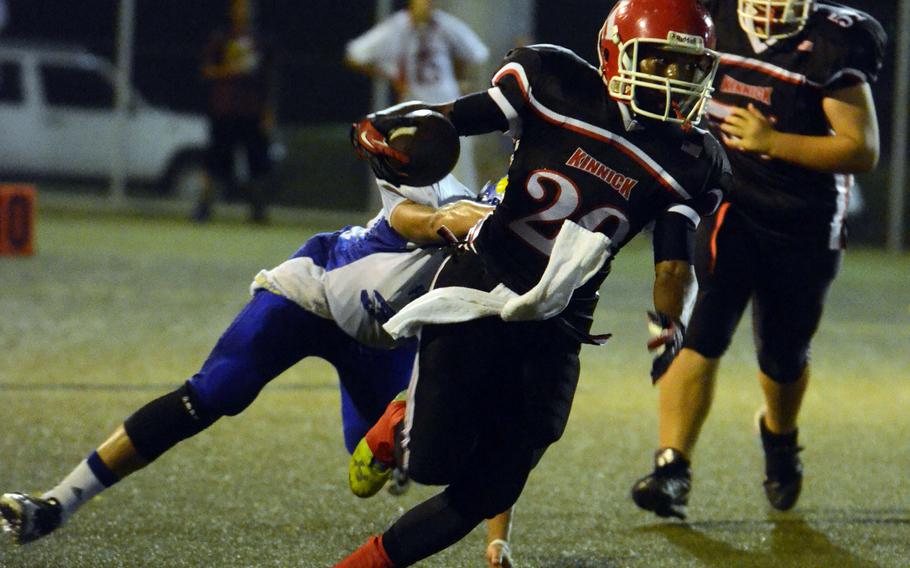 Nile C. Kinnick sophomore running back Dre Paylor eludes a Yokota defender during Friday's DODDS Japan-Kanto Plain Association of Secondary Schools Division I football game at Yokosuka Naval Base, Japan. Paylor rushed for a Japan-record 371 yards on 30 carries and scored four times as the Red Devils won 55-27, their first win over the Panthers since Oct. 16, 1998.