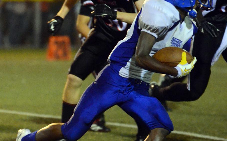 Yokota sophomore running back J.J. Henderson looks to turn the corner against the Nile C. Kinnick defense during Friday's DODDS Japan-Kanto Plain Association of Secondary Schools Division I football game at Yokosuka Naval Base, Japan. The Red Devils won 55-27, their first win over the Panthers since Oct. 16, 1998.