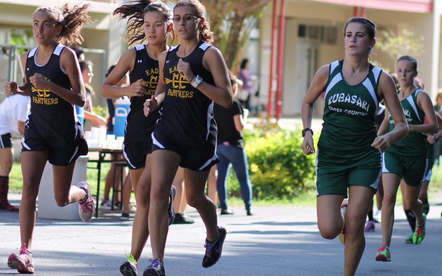 Natalie Fontenot, Wren Renquist and Ana Hernandez of Kadena and Jessica Freedman of Kubasaki lead the pack at the start of the girls 3.1-miler during Wednesday's Okinawa Activities Council cross-country meet at Yomitan, Okinawa. Hernandez, the reigning Far East Division I and overall champion, won in 20 minutes, 13 seconds, her second win of the season.