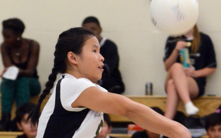 Daegu defender Rose O'Houlahan bumps the ball against Humphreys during Friday's Korean-American Interscholastic Activities Conference girls volleyball match at Camp George, South Korea. The Warriors won 25-17, 25-7, 25-16, improving to 6-0 with all six wins coming in straight sets.
