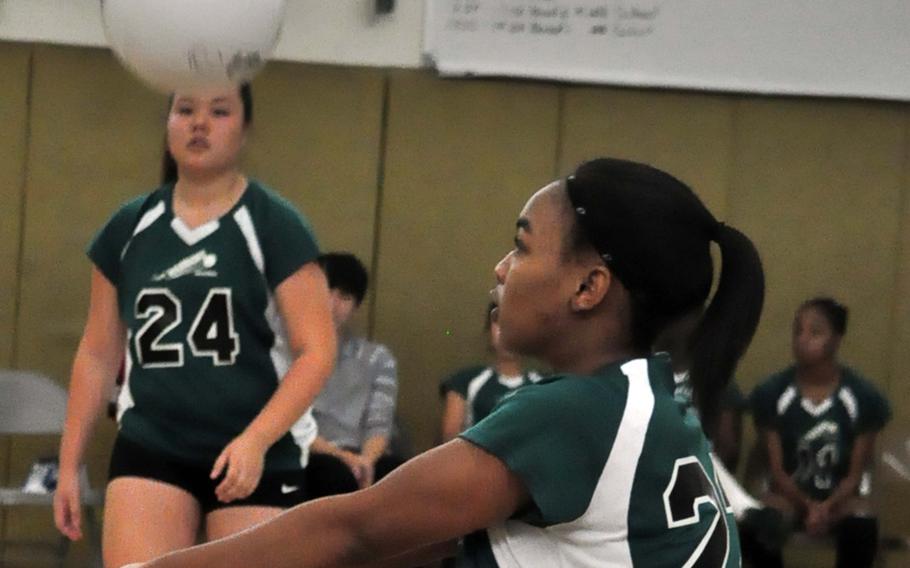 Daegu outside hitter Rheagan Wyche bumps the ball against Osan during Saturday's Korean-American Interscholastic Activities Conference girls volleyball match at Camp George, South Korea. The Warriors won for the seventh time this season, all in straight sets.