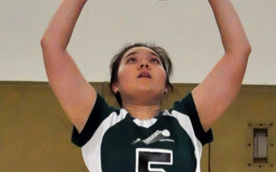 Daegu setter Kaitlyn Nott sets the ball against Osan during Saturday's Korean-American Interscholastic Activities Conference girls volleyball match at Camp George, South Korea. The Warriors won for the seventh time this season, all in straight sets.