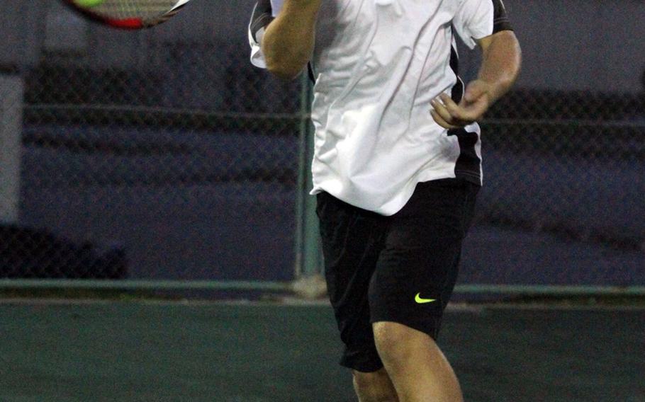 Kadena's Nicholas Lay hits a forehand return against Kubasaki doubles pair Brenden Neu and Mark Ebarle during Thursday's Okinawa Activities Council tennis tie at Kadena Air Base, Okinawa. Lay and Daniel Wartella teamed to beat Neu and Ebarle 6-2, 6-7 (3-7), 7-6 (7-5). Neu beat Lay in singles play 1-6, 6-4, 7-6 (7-0).