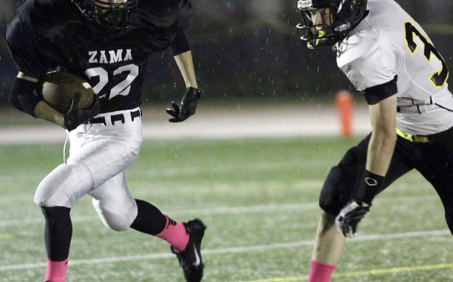 Zama American running back Hiro Beale tries to sidestep Mizuki Shumsky of American School In Japan during Friday's Kanto Plain Association of Secondary Schools football game at Naval Air Facility Atsugi, Japan. ASIJ won 35-6, improving to 5-0 this season.