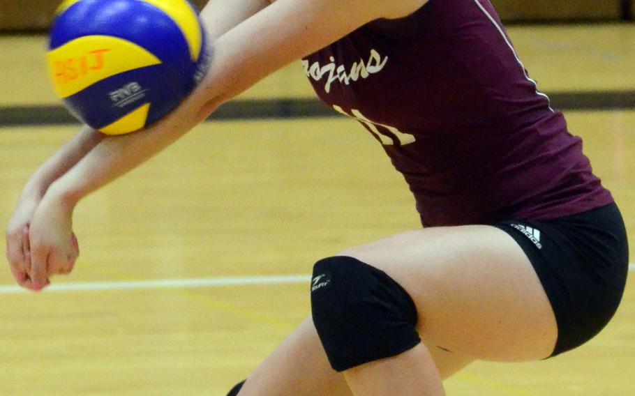Zama American's Katrina Reid receives a serve against American School In Japan during Thursday's Kanto Plain Association of Secondary Schools girls volleyball match at ASIJ Chofu campus, Tokyo. The Mustangs remained unbeaten at 10-0, beating the Trojans 25-10, 25-7, 25-14.