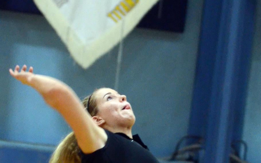 American School In Japans Mia Weinland readies a spike kill against Zama American during Thursday's Kanto Plain Association of Secondary Schools girls volleyball match at ASIJ Chofu campus, Tokyo. The Mustangs remained unbeaten at 10-0, beating the Trojans 25-10, 25-7, 25-14.