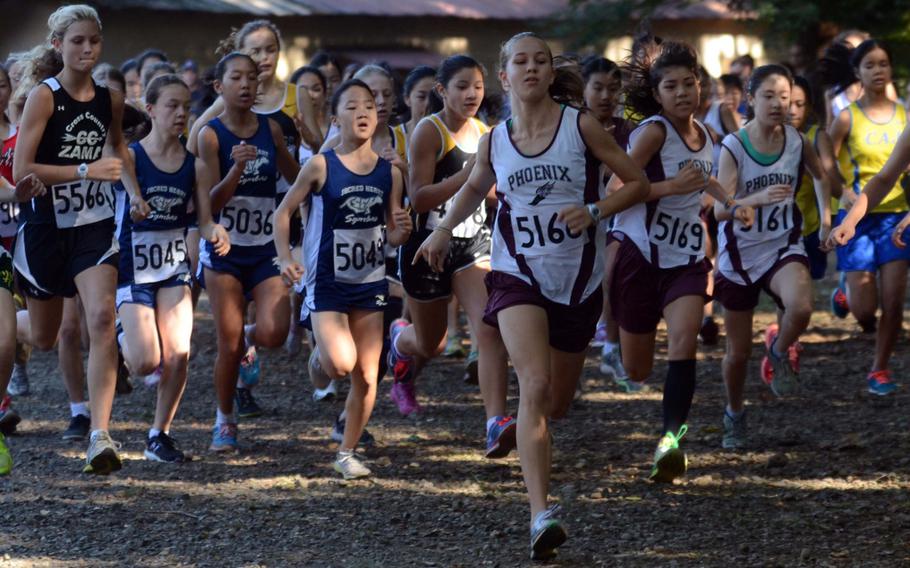 Seisen International School eighth-grader Brittani Shappell seizes the early edge ahead of the pack just after the start of Saturday's Kanto Plain Association of Secondary Schools cross-country finals middle-school at Tama Hills Recreation Center, Tokyo in November. Although non-DODEA middle-school runners like Shappell will still be able to compete in varsity events, DODEA athletes are out of the running.