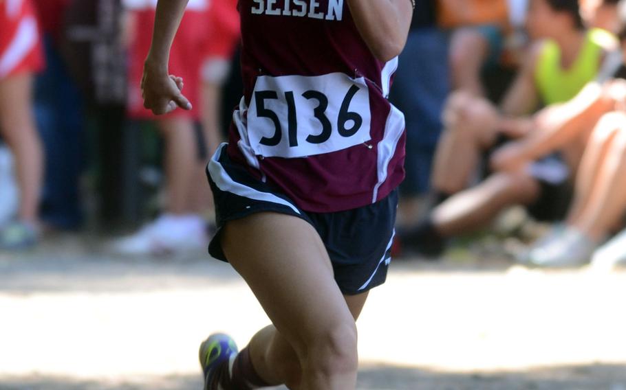 Seisen International School senior Lisa Kwak approaches the finish line of Saturday's Kanto Plain Association of Secondary Schools cross-country finals high-school 2.1-mile girls race at Tama Hills Recreation Center, Tokyo. Kwak won in 13 minutes, 22 seconds.