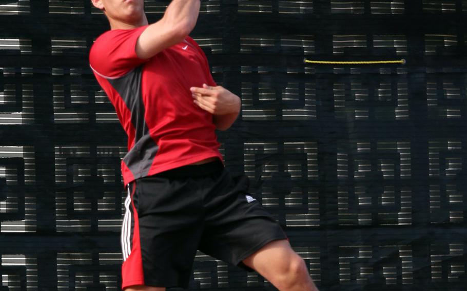 Seoul American's Andrew Clark fires a forehand volley against St. Mary's International's Juan Borga during a Tuesday's boys singles quarterfinal in the Far East High School Tennis Tournament at Kadena Air Base, Okinawa. Clark lost to Borga 8-6.