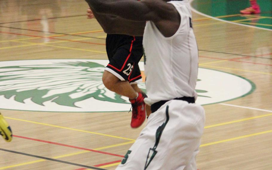 Daegu's Dawud Abdul-Azeez tosses an entry pass against Seoul Foreign during Wednesday's Korean-American Interscholastic Activities Conference Blue Division boys basketball game at Camp George, South Korea. The Warriors won 74-48, improving to 2-1 this season.