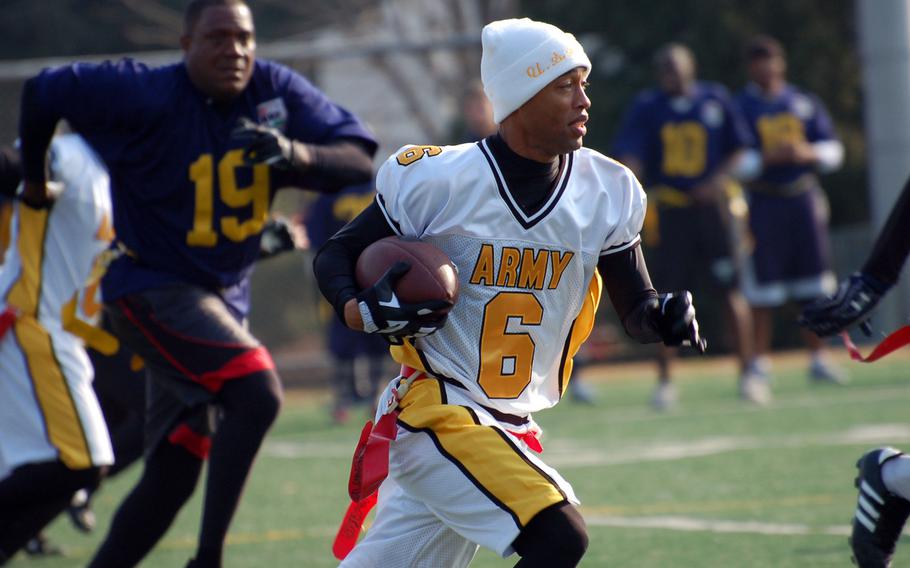 Army running back Morris Campbell dashes downfield during Saturday's Korea Army-Navy flag football rivalry game at Yongsan Garrison, South Korea. The soldiers routed the sailors 62-0, improving to 14-3 in the Peninsula Trophy series.