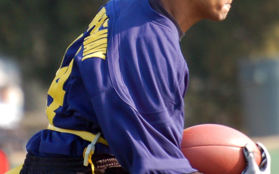 Navy running back Jerdonte Williams looks for room downfield during Saturday's Korea Army-Navy flag football rivalry game at Yongsan Garrison, South Korea. The soldiers routed the sailors 62-0, improving to 14-3 in the Peninsula Trophy series.