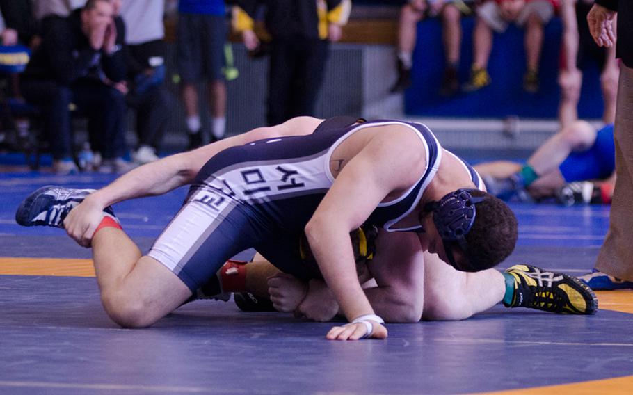 Seoul American's Michael Warner attempts a lock on Kadena's James Alexander in a 168-pound class match at Yokota High School during the first round of the Far East High School Wrestling Tournament Feb. 13, 2014. Alexander won by technical fall 10-1 in 2 minutes, 41 seconds.