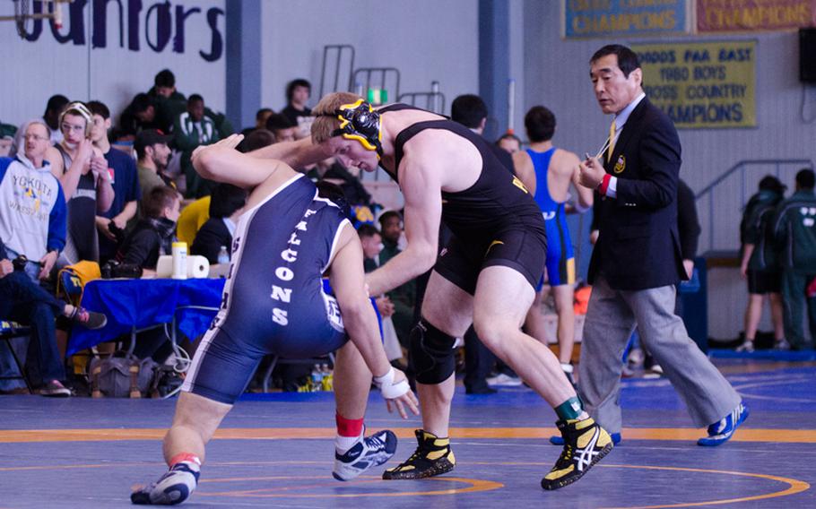 Seoul American's Michael Warner attempts an ankle pick on Kadena's James Alexander in a 168-pound class match at Yokota High School during the first round of the Far East Tournament Feb. 13, 2014. Alexander won by technical fall 10-1 in 2 minutes, 41 seconds.