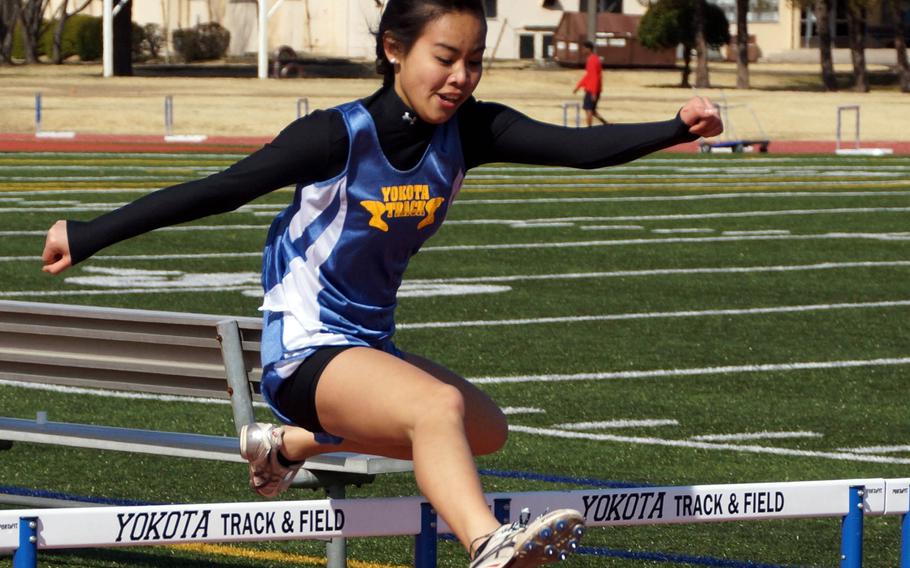 Yokota Panthers freshman Ai Veazey negotiates a hurdle down the home stretch of the 300 low hurdles during Saturday's DODDS Japan/Kanto Plain season-opening track and field meet at Yokota Air Base, Japan. Veazey won the event.
