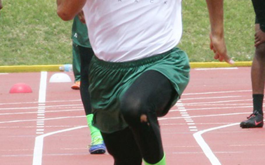 Kubasaski's Rahman Farnell pounds for the finish of the boys 400-meter relay during Saturday's Okinawa Athletics & Activities Council high school track-and-field meet at Kadena Air Base, Okinawa. Farnell, the anchor, and the Dragons won in a Pacific-record 42.9 seconds, breaking the old mark of 43.34 set three seasons ago, also by Kubasaki.