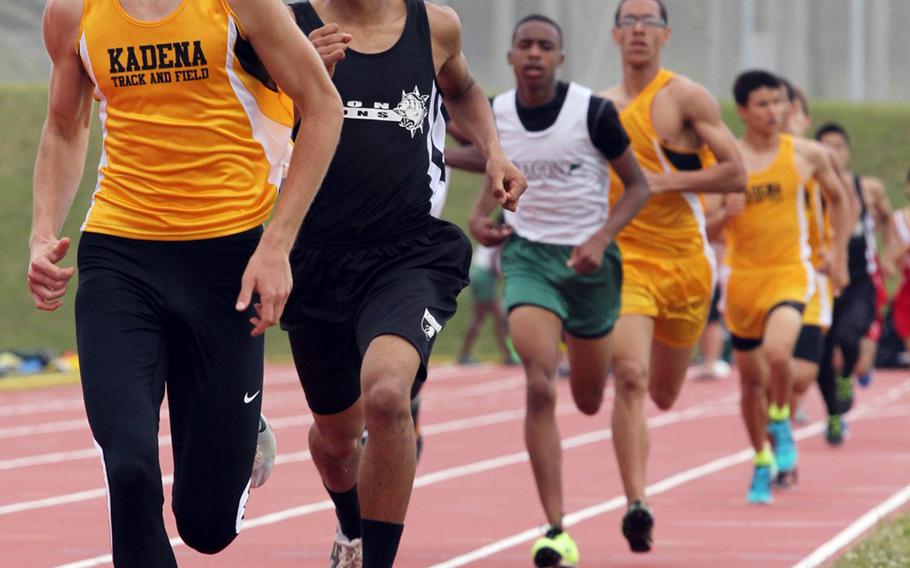 Kadena's Hunter Ficenec and Zion Christian Academy International's Rejay Maruo lead the pack in the boys 800-meter run during Saturday's Okinawa Athletics & Activities Council high school track-and-field meet at Kadena Air Base, Okinawa. Ficenec won with a time of 2 minutes, 3.91 seconds.