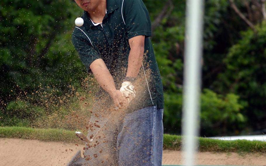 Kubasaki's Jared Rosario blasts out of the right-side bunker on the 345-yard, par-4 15th hole during Wednesday's first round of the Okinawa district golf finals on the 6,714-yard, par-72 Banyan Tree Golf Course on Kadena Air Base, Okinawa. Rosario carded a 105, good for fifth place; the second and final round is scheduled for Friday at Taiyo Golf Course in Gushikawa.