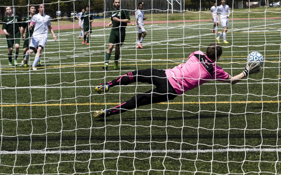 Austin Burdick of Robert D. Edgren attempts to block a shot on goal during pool play of the DODDS Japan Boys Soccer Tournament on Friday in Yokota, Japan. Edgren would end up losing to Nile C. Kinnick 2-0.