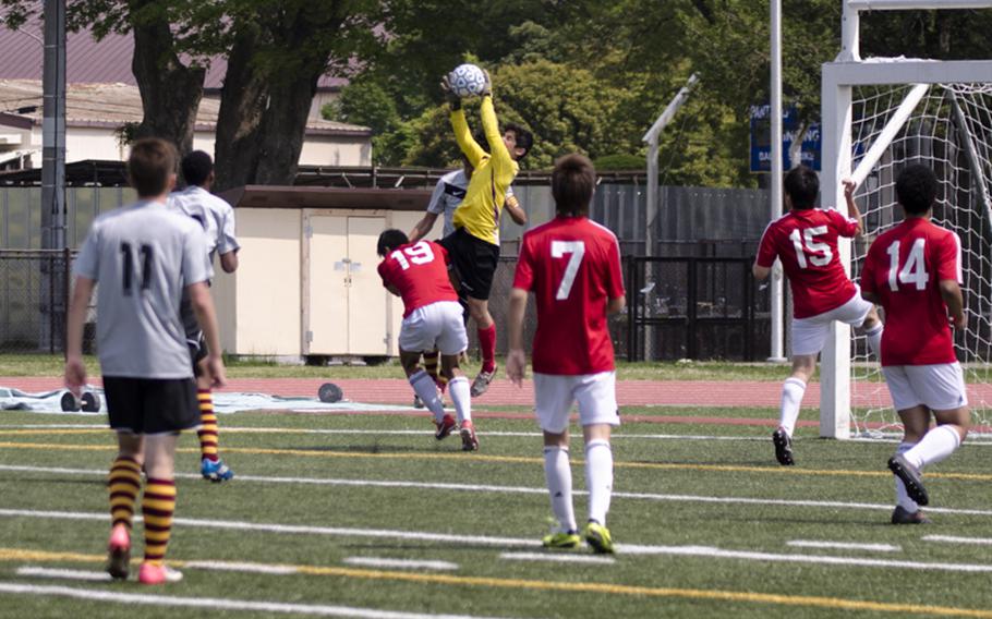 Brady Yoder of Kinnick makes a leaping save during the first half of the DODDS Japan Boys Soccer Tournament Championship on Saturday in Yokota, Japan. Perry won the tournament title 1-0.