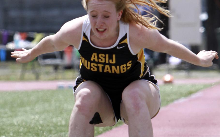 American School In Japan senior jumper Liz Thornton landed in the long jump pit on Monday in record fashion, breaking her own standard in the Far East High School Track and Field Meet.