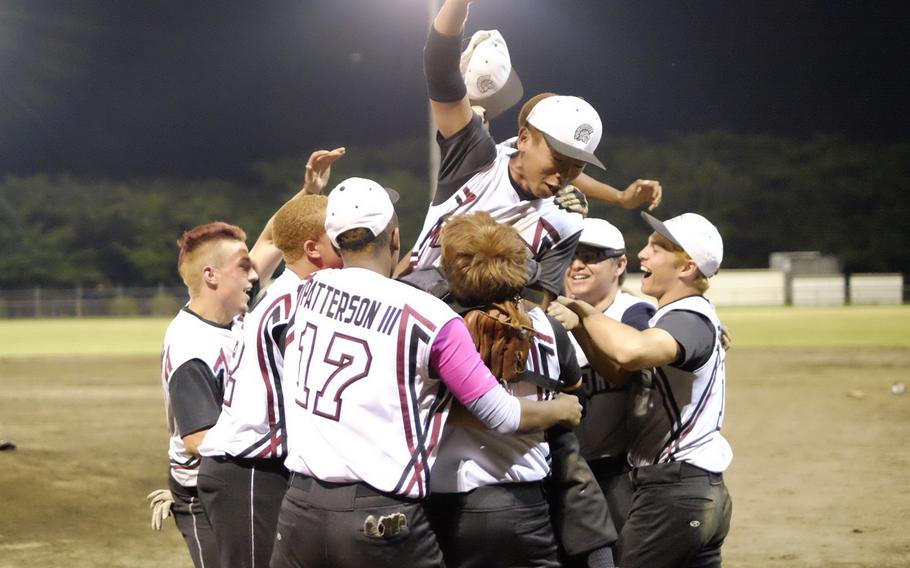Zama American celebrates after winning the Far East Division II baseball championship final Saturday over Matthew C. Perry, 3-0.