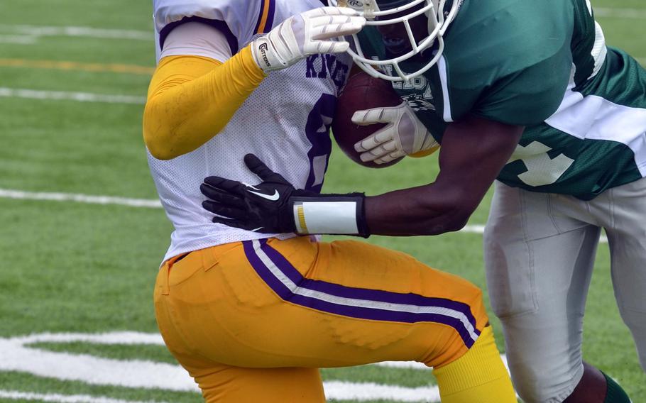 Hansen DB Alexander Williams looks to corral Kinser ballhandler Devante Dudley.