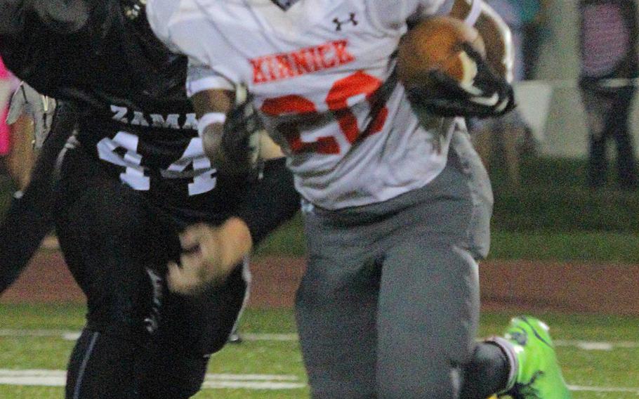 Nile C. Kinnick's Dre Paylor rushed for 265 yards and three touchdowns against Zach Dignan and Zama in the Red Devils' 30-0 victory Friday night.
