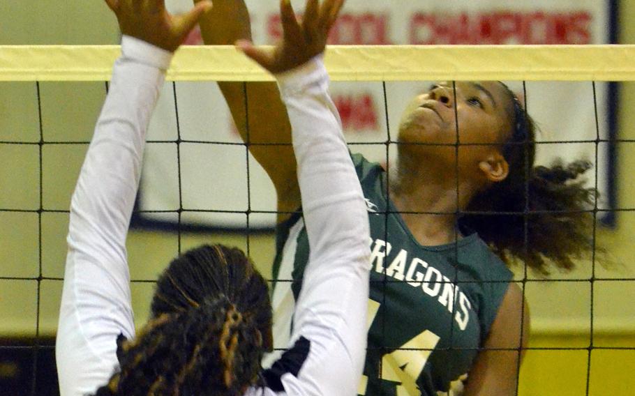 Kubasaki's Josie Daffin goes up for the ball against Kadena's Tori Pickens during Thursday's volleyball match. The Dragons won 25-15, 25-15, 25-14.