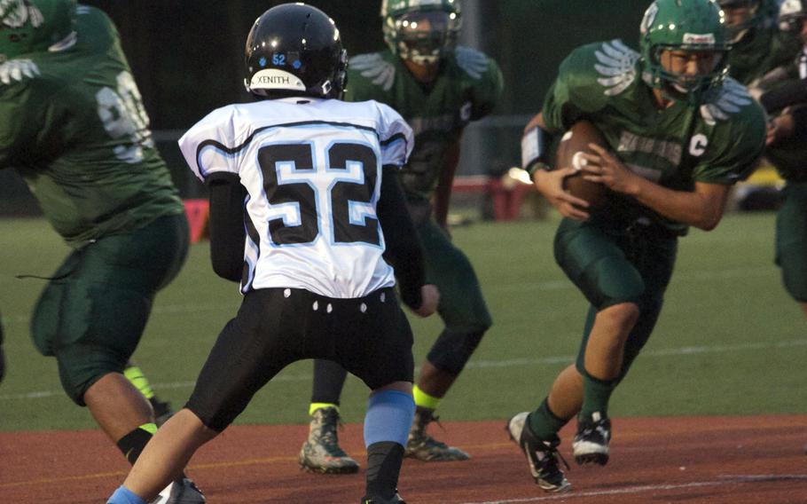 Osan's Kai Chatfield-Kinjo seems outnumbered by a sea of green-clad Daegu Warriors, including ball carrier Tyler Pak.
