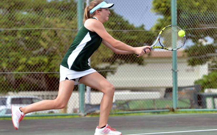 Kubasaki sophomore Mary Neitzke strikes a backhand against Kadena's Lily Oliver during Thursday's final Okinawa regular-season tennis tie at Kadena Air Base, Okinawa. Oliver won the singles 6-1, 6-0, but Neitzke later teamed with Allie Powers to down Oliver and Nuree Howell 6-3, 7-6 (7-3).