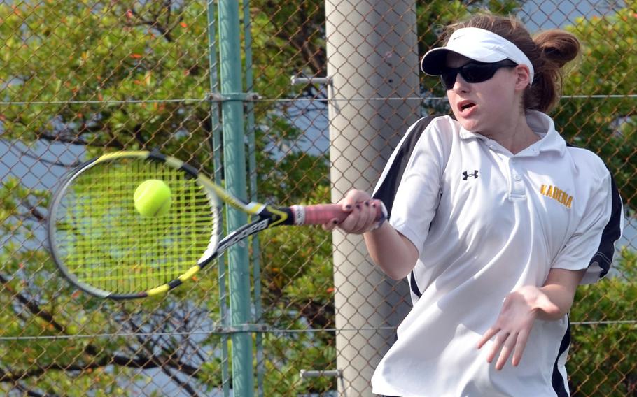 Kadena freshman Lily Oliver ripis a forehand return against Kubasaki sophomore Mary Neitzke during Thursday's final Okinawa regular-season tennis tie at Kadena Air Base, Okinawa. Oliver won the singles 6-1, 6-0, but Neitzke later teamed with Allie Powers to down Oliver and Nuree Howell 6-3, 7-6 (7-3).