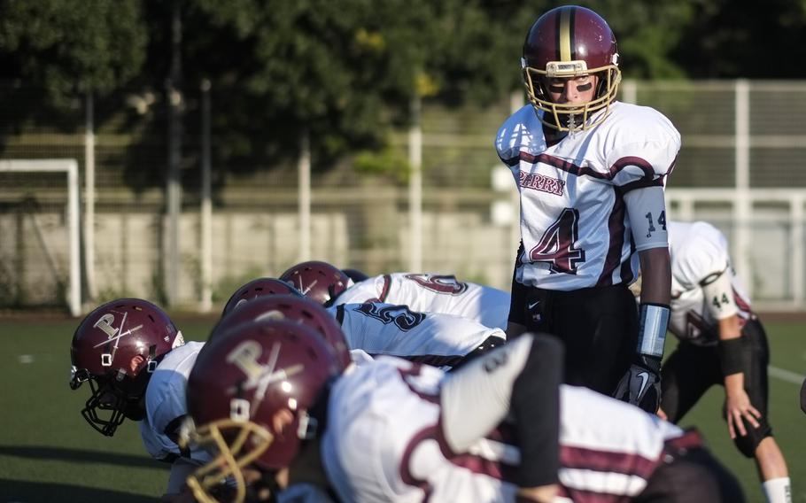 Matthew.C. Perry quarterback Garrett Macias checks the formation prior to snapping in the first quarter of the Samurai visit to American School In Japan in Chofu, Japan on Oct. 3, 2014. Perry lost their first game of the season 41-0.
