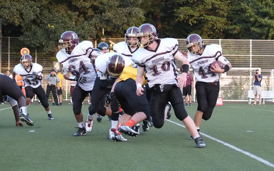 Matthew C. Perry running back Caeleb Ricafrente follows his blockers through Perry's triple wing offense during the first quarter of the Samurai visit to American School In Japan in Chofu, Japan on Oct. 3, 2014. The Samurai lost their first game of the season 41-0.