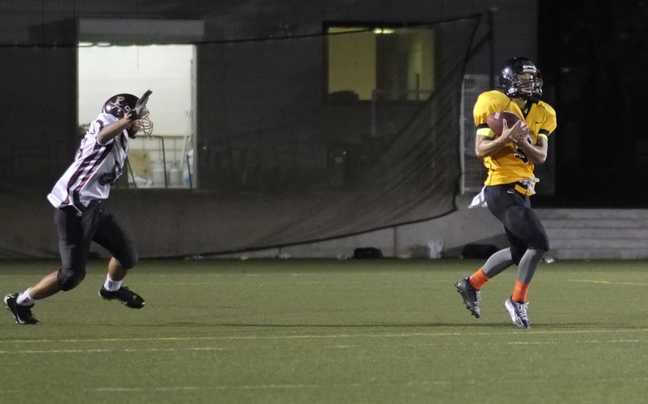 American School In Japan defensive back Ray Hotta intercepts a pass in the fourth quarter of the Mustangs and Matthew C. Perry Samurai game in Chofu, Japan on Oct. 3, 2014. Hotta's interception sealed the Mustangs' shutout in a 41-0 rout.