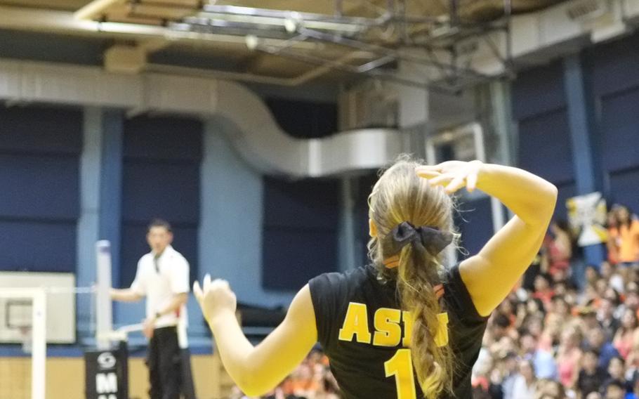 American School In Japan's Sammie Hoskins serves against rival Nile C. Kinnick from Yokosuka, Japan, on Friday, Oct. 3, 2014,  in Chofu, Japan. Hoskins led the game with 22 assists in ASIJ's straight set victory over Kinnick 25-17, 25-19, 27-25.