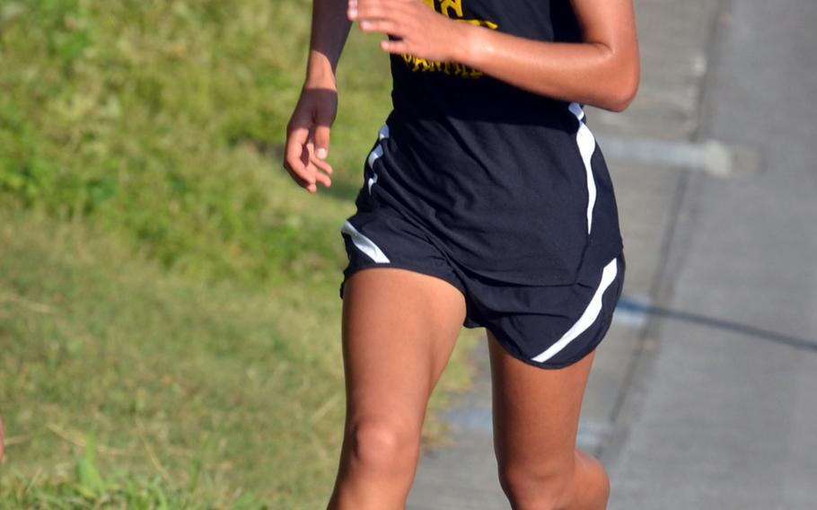 Kadena sophomore Wren Renquist charges up the final hill toward the finish line during Wednesday's Okinawa cross country regular-season final meet. Renquest won in 20 minutes, 32 seconds and finished the regular season with five race victories and one second place.