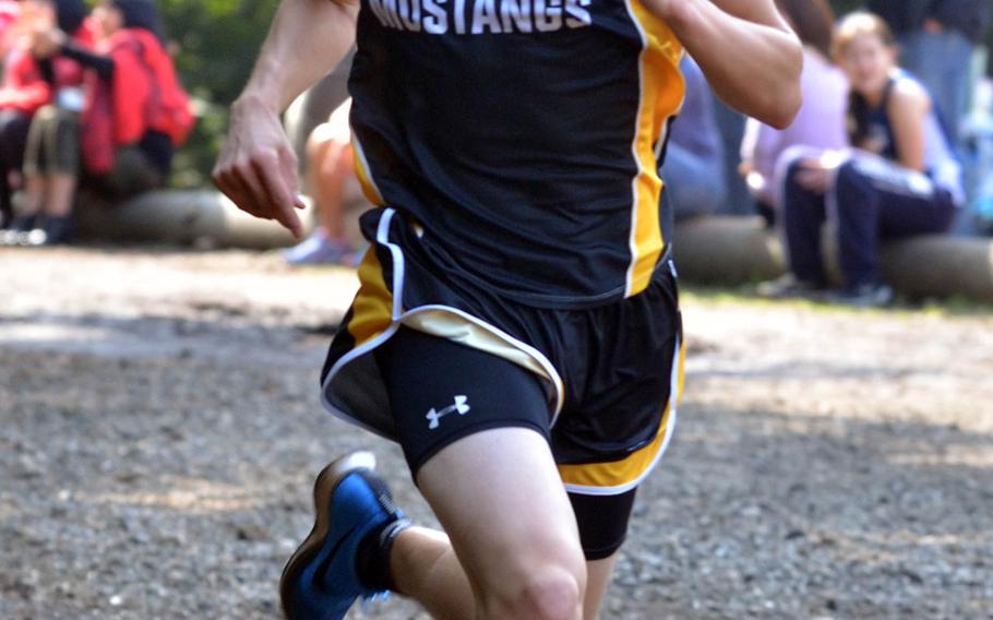 Evan Yukevich of American School In Japan heads for the finish and a first-place time of 14 minutes, 51.1  seconds in the Kanto cross country finals at Tama.