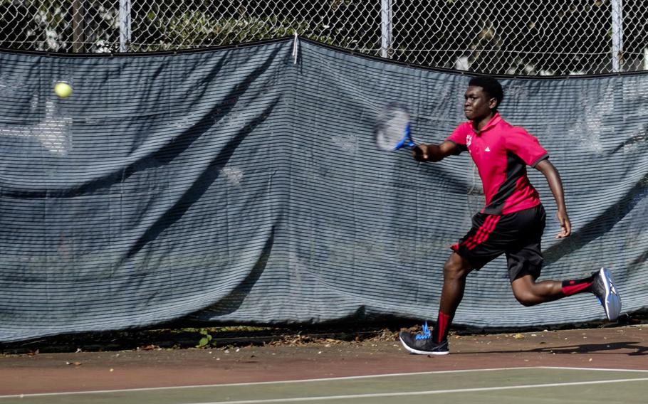 Nile C. Kinnick's Khaleel Graham takes a shot down the line Saturday during the DODDS Japan Tournament boys doubles consolation bracket play at Camp Zama, Japan.