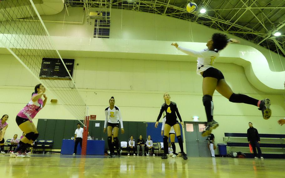 Kadena's Rheagan Wyche soars for a spike kill against Christian Academy of Japan during round robin play of the Far East Tournament at Yokota Air Base, Japan Nov. 3. Kadena is off to a 1-2 start coming into the statistically tougher half of the draw.