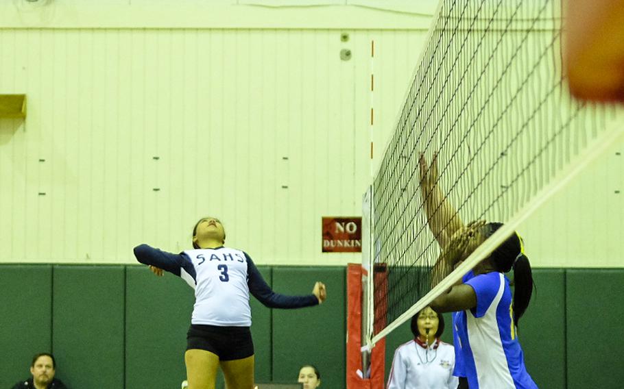 Seoul American's Trisha Mae Jose leaps for a spike kill in the Falcons opening loss to Yokota at the second day of the Far East Tournament round robin at Yokota Air Base, Japan Nov. 4.
