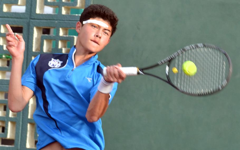 Seoul American's Nick Gagnet slams a forehand against American School In Japan's Len Kamemoto, who beat Gagnet 8-0 in Tuesday's quarterfinal  in the Far East High School Tennis Tournament. Gagnet suffered a cut over the eye during the very first rally of the game; he played with it taped up the rest of the match.