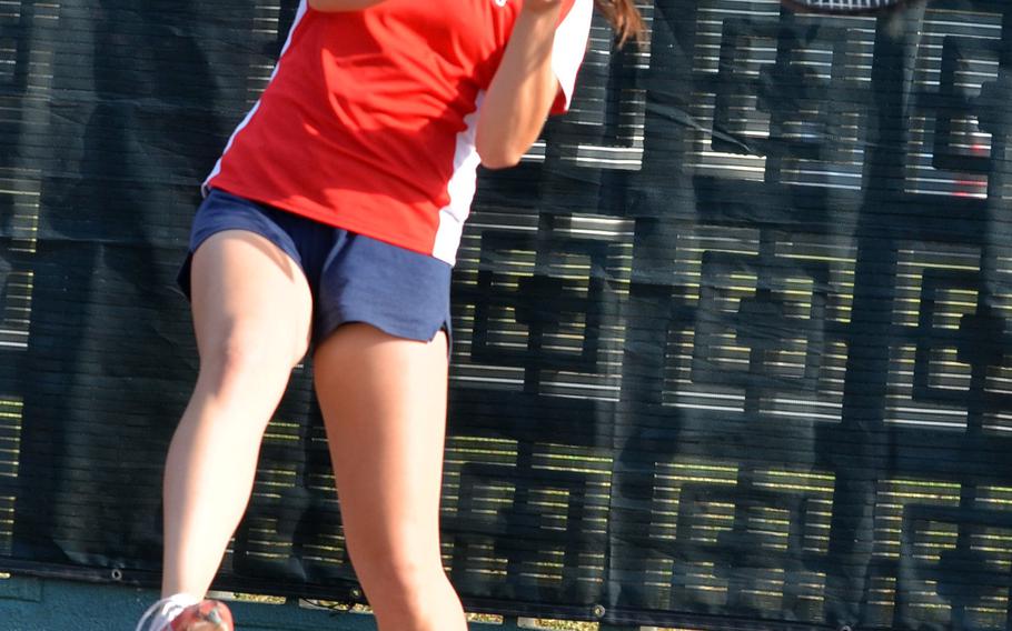 Nile C. Kinnick's Raena Schoeff smacks a backhand return during her 8-5 quarterfinal loss Tuesday to Matilde Piras of Seisen International during the Far East High School Tennis Tournament.