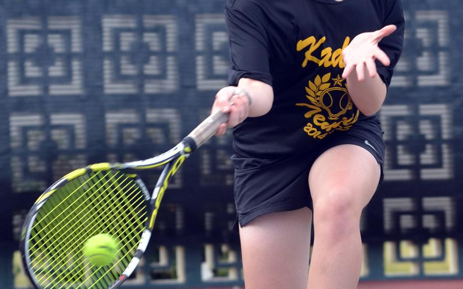 Kadena's Lily Oliver races forward for a forehand return during her 8-6 quarterfinal loss Tuesday to Ana Clara Borga of Seisen International during the Far East High School Tennis Tournament.